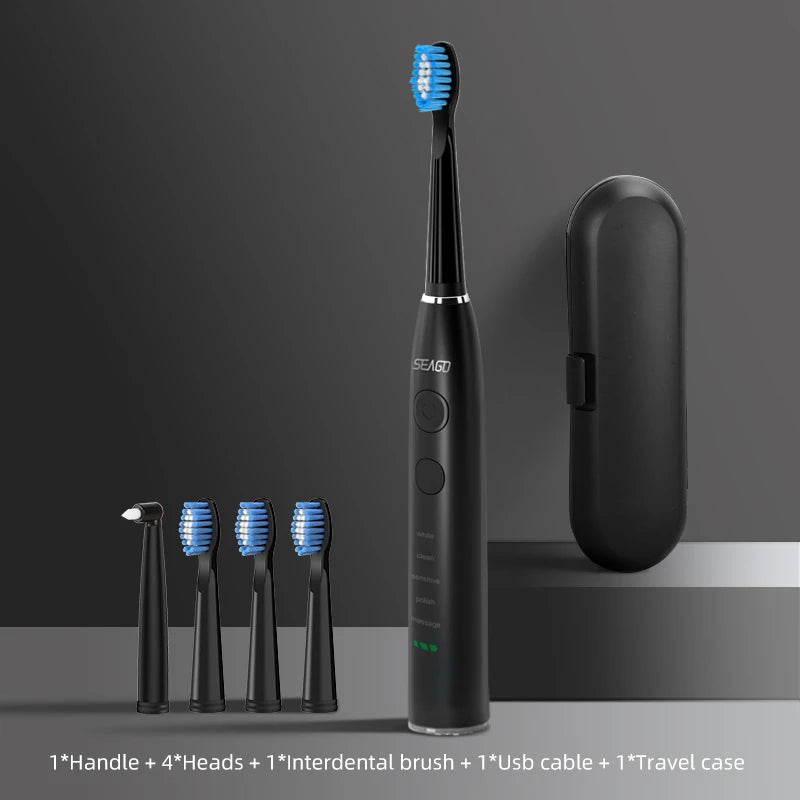 Black electric toothbrush with four brush heads and a travel case on a gray background
